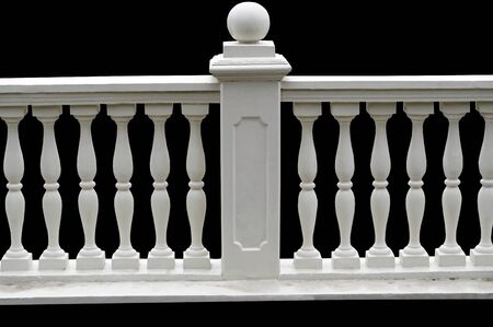 beautiful stone white fence on black backgroundの写真素材