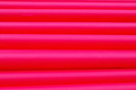 Many long red water plastic pipe for buildingの写真素材