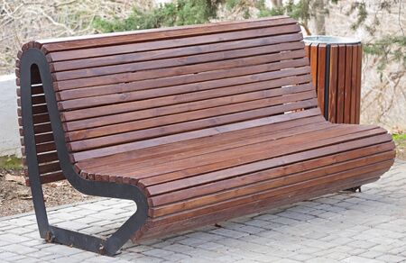Wooden bench in the city park