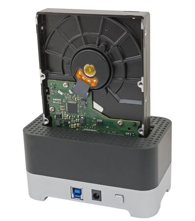 Hdd hard drives in docking station on white background