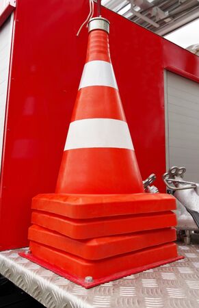 the new traffic cone with white and orange stripes