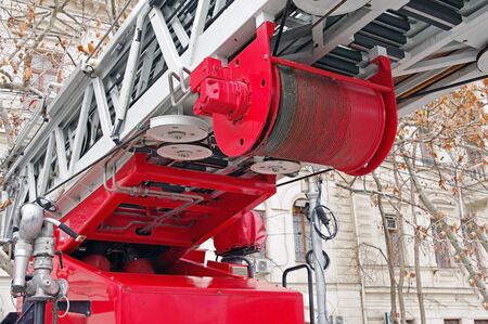 drum with a metal cable for lifting stairs on a fire truck