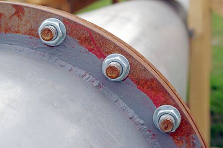 Pipe flange with bolts connecting between pipe and water tank