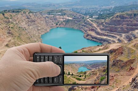 the photographer takes a photo on a cell phone