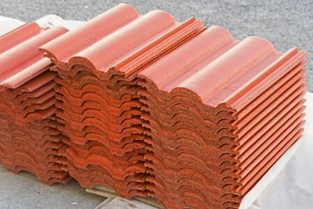 Orange roof tiles laid on many stacked in layers