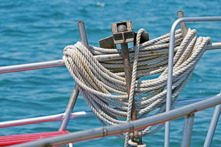 Bollard with rope on the deck of a pleasure boat