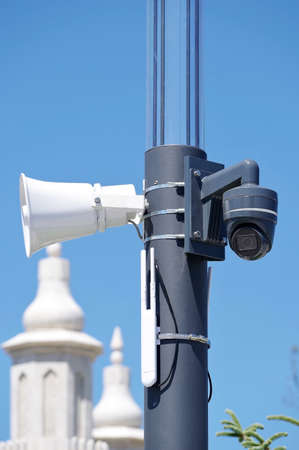 Safety ip cameras and loud speaker for monitoring against the blue sky