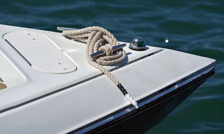 Bollard with rope on the deck of a pleasure boat