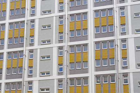 Modern panel apartment building with plastic windows and insulated walls