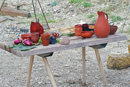 Ceramic dishes on a wooden table at the exhibitionの写真素材