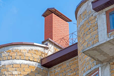 unfinished house made from yellow stone