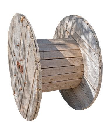 Wooden cable coil isolated on white backgroundの写真素材