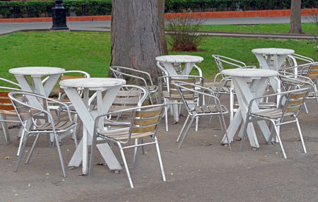the chairs and table in the summer cafe