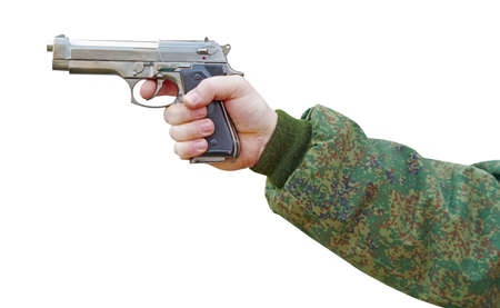 a gun in the hand of a military man on white background