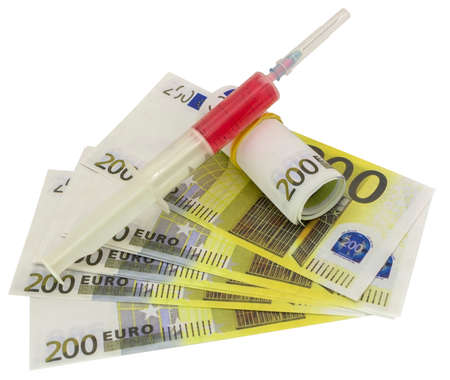 Euro currency with syringe, the concept of addictionの写真素材