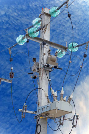 Electrical towers on a background of the blue sky