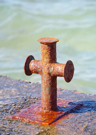 big old rusty Bollard on moorageの写真素材