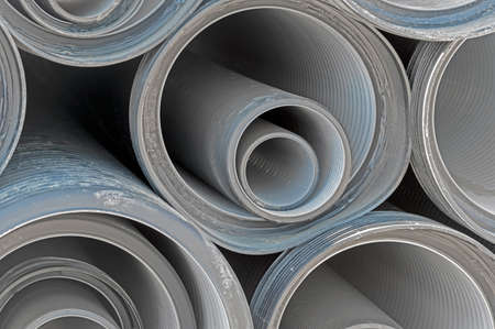 black plastic pipes for water supply or sewerage prepared for installation or repair of the water supply systemの写真素材