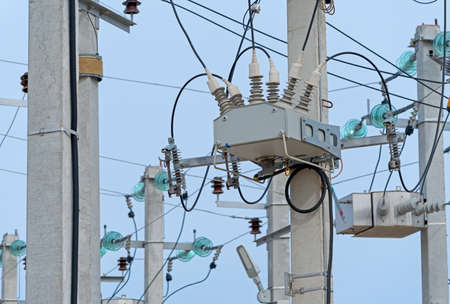 Electrical towers on a background of the blue sky