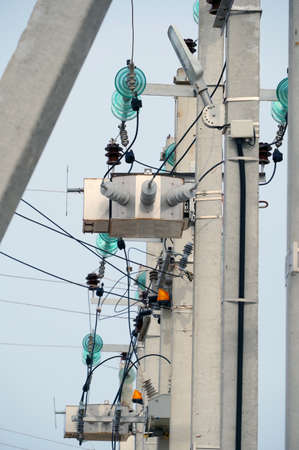Electrical towers on a background of the blue sky