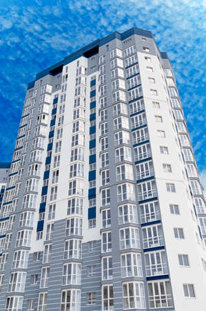 Modern panel apartment building with plastic windows and insulated walls