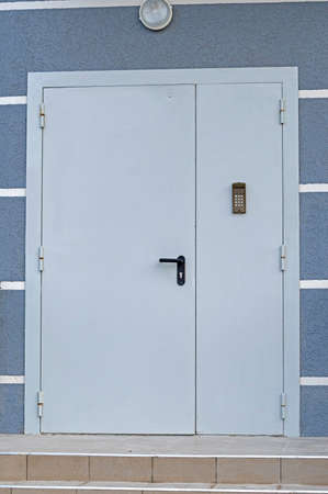 new metal door to the entrance with an intercom