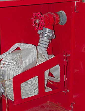 Fire extinguisher and fire hose reel close-up