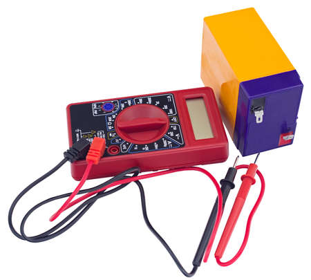 Testing an acid rechargeable battery with a measuring instrument isolated on white background