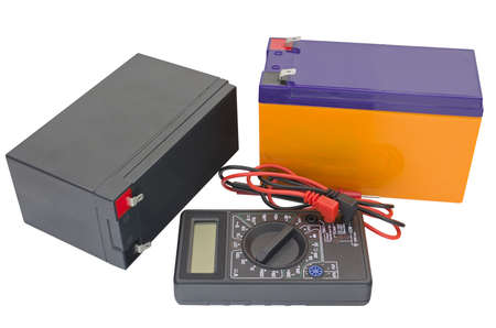 Testing an acid rechargeable battery with a measuring instrument isolated on white background
