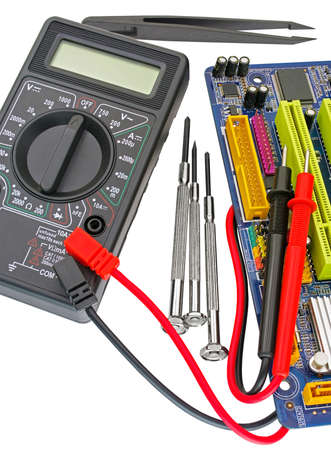 Digital multimeter and motherboard on a white background