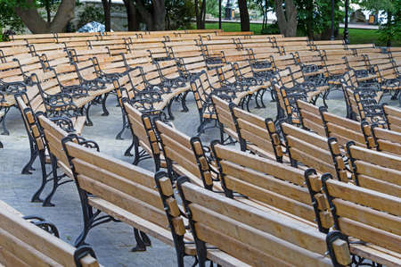 many Wooden Park Benches In one place