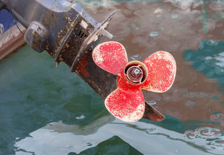 boat propeller on hub of outboard motor close upの写真素材