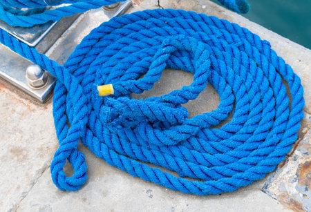 the blue coiled rope on moorage