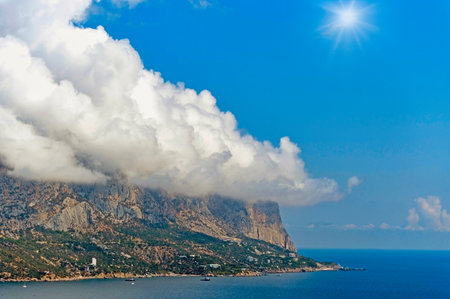 landscape with a Clouds above a seashore by a spring morningの写真素材
