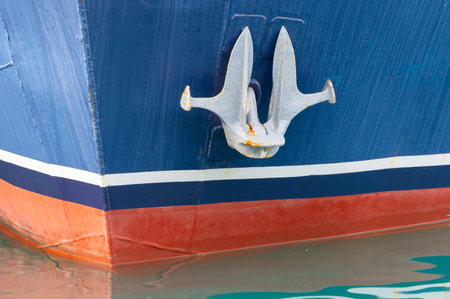 the Bow of a old boat with anchorの写真素材