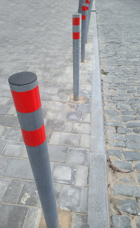 the new restrictive posts between the pedestrian sidewalk and the roadの写真素材