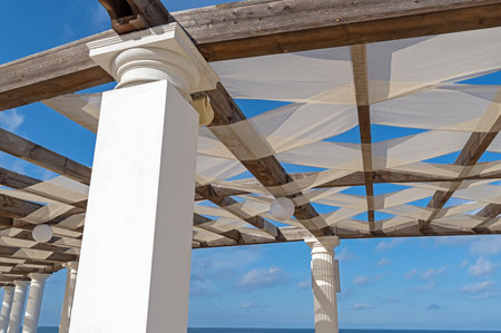 Wooden pavilion, wood pergola for sun protection on the beachの写真素材
