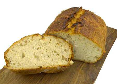 a loaf of freshly baked bread on a wooden tray