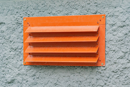 New Orange vent on the wall of the house