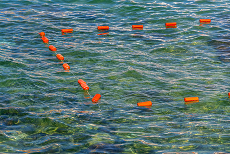Floating swimming barrier at the public beachの写真素材