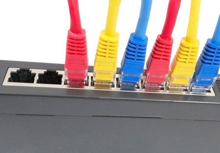 Closeup of network cables connected to router on white