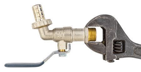 Adjustable wrench work spanner and water valve on white backgroundの写真素材