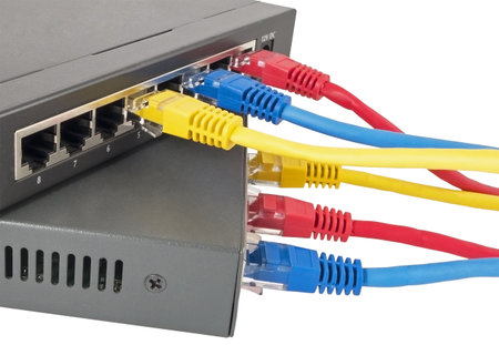 Closeup of network cables connected to router on white