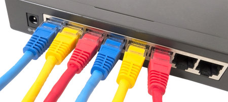 Closeup of network cables connected to router on white