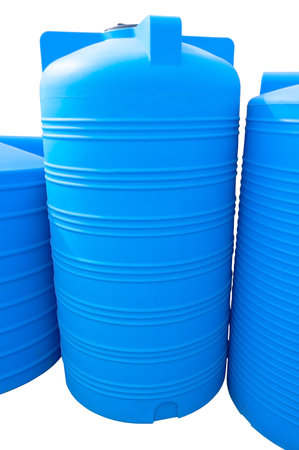 Blue plastic water and liquids barrel storage industrial containers isolated on white backgroundの写真素材
