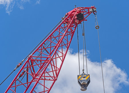 close up at top beam of crane mobile on background of blue skyの写真素材