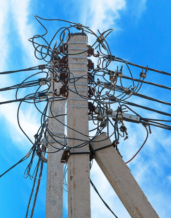 View of power high voltage transmission lines with many wires to transmit and deliver electricityの写真素材