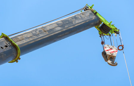 close up at top beam of crane mobile on background of blue skyの写真素材