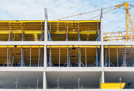 Construction of buildings using monolithic technology. Reinforced concrete frame of the building, reinforcement, formwork for pouring concrete.の写真素材