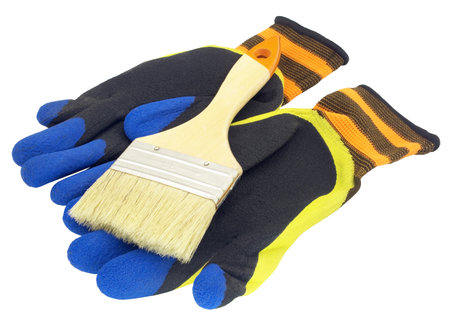 Paint brushes and protective gloves on a white background.の写真素材